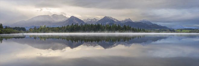 Sunrise, Lake Hopfensee, near Füssen, Ostallgäu, with the Tannheim Mountains behind, Allgäu,