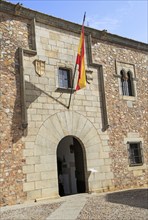 Spanish flag Torre de las Ciguenas, in medieval old town, Caceres, Extremadura, Spain, Europe