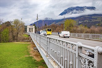 The Talfer Bridge with a view of the Victory Monument in Bolzano, South Tyrol, Italy, Europe