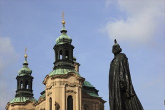 Jan Hus Monument on Old Town Square and the baroque St Nicholas Church, Prague, Czech Republic,