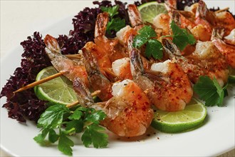 Shrimp kebab, with spices, lime, on wooden skewers, top view, no people