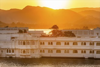 Sunset, backlight, Taj Lake Palace Heritage or Palace Hotel, Lake Pichola, Udaipur, Rajasthan,