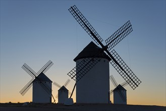 Silhouettes of windmills against a clear sky at sunset, windmills, Campo de Criptana, Ciudad Real