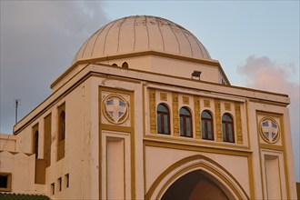 Market Hall, Nea Agora, close-up of a historic building with a large dome, arches and pinkish beige