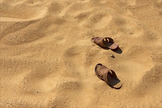 Two sandals on sandy ground in a desert, Matruh, Great Sand Sea, Libyan Desert, Sahara, Egypt,