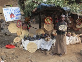 Amhara region, in the Falasha village of Wolleka near Gondar, Gonder, woman selling home-made