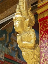 Gilded deity statue, Wat Phonxay, Luang Prabang, Laos, Asia