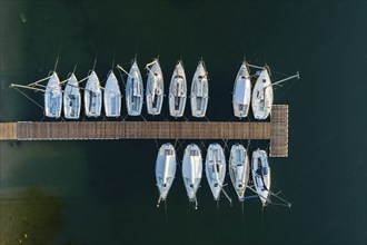 Aerial view of sailing boats on a quay in the water, autumn, Riegsee, Alpine foothills, Upper