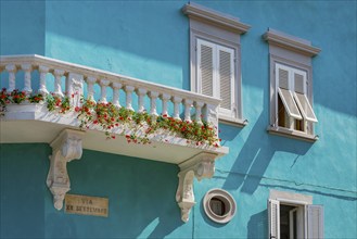 Colourful facade with balcony, flowers, turquoise, colourful, Elba, Tuscany, Italy, Europe