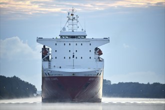 RoRo cargo ship Super Fast Levante travelling through the Kiel Canal at sunrise, Kiel Canal,