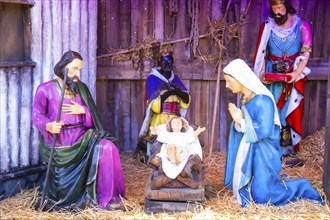 Life-size figures in a nativity scene scene at the Christmas market at City Hall, Vienna, Austria,