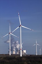 Wind turbines at the Garzweiler open-cast lignite mine with the Neurath power station in the