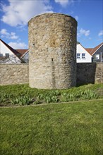 Tower under a blue sky with white cumulus clouds in the historic town wall of Hattingen,