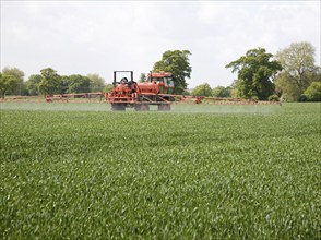 Spraying arable crop, Sutton, Suffolk, England, United Kingdom, Europe