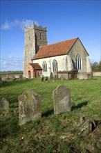 The Church of St Mary, Letheringham, Suffolk, England, now in the middle of far buildings is all