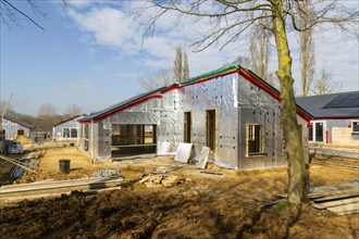 Building site single storey bungalow homes, timber frame construction, thermal insulation, Ufford,