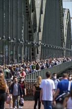 Many people on the Hohenzollern Bridge, footpath, railway bridge over the Rhine, Cologne, North