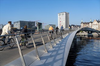 Cyclists on the Lille Langebro cycle and pedestrian bridge over the harbour, Copenhagen is