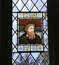 Victorian stained glass window inside Church of All Saints, Brandeston, Suffolk, England, UK