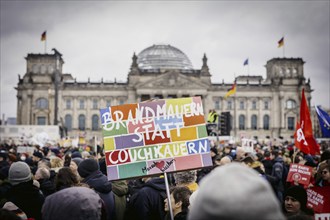 Posters at the large demonstration against the right in Berlin under the slogan We are the firewall