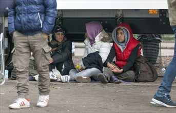 Refugees from Syria waiting to be registered at the Central Reception Centre for Asylum Seekers at