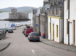 General view of the main shopping street in Castlebay the largest settlement in Barra, Outer