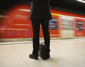 Underground arriving S-Bahn, train, platform, stop, station city centre, public transport, movement