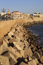 Coastal view east of rock armour coastal defences near city centre, Cadiz, Spain, Europe