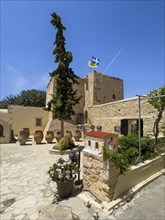 Inner courtyard of Odigitria Monastery In the foreground model of church left in the background