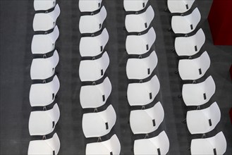 Seats with seat shells, at an event, still unused, in row