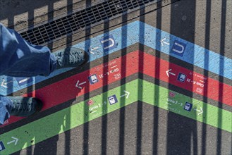 Signpost on the pavement, for bus and train diversions at Dortmund Central Station, during