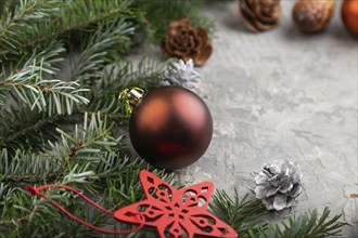 Christmas or New Year composition. Decorations, cones, cinnamon, fir and spruce branches, cup of