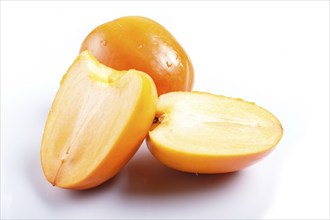 Ripe orange persimmon isolated on white background. closeup