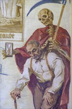 Farmer and Death as Grim Reaper, fresco in the arcades in the town park, former cemetery, Schwaz,