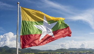 Flags, the national flag of Myanmar flutters in the wind