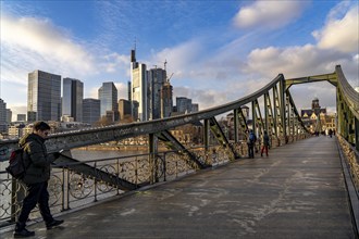 Skyline of the city centre of Frankfurt am Main, river Main, Eiserner Steg bridge, dusk, Hesse,