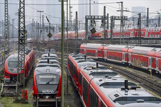 Railway tracks with regional trains, after freezing rain, in front of Frankfurt main station,