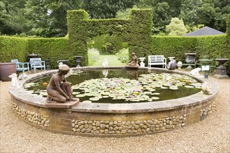 Lily pond at the The Walled garden plant nursery, Benhall, Suffolk, England, UK