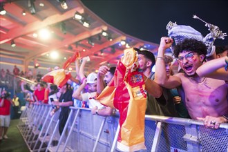 Spanish fans celebrate after scoring the 2:1 goal at the Adidas fan zone at the Bundestag during