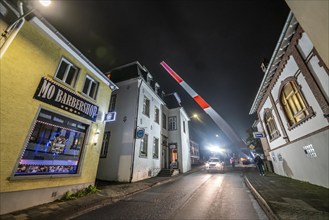 Transport of a 68 metre long, 22 tonne blade of a wind turbine, here in Breckerfeld, with a