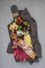 Appetizer, assortment, set, sausage, and cheese, on a wooden board, top view, no people