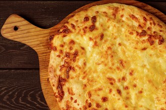 Imereti khachapuri, Traditional Georgian dish, flatbread with cheese, top view, no people, rustic