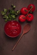 Tomatoes in their own juice, sliced, tomato sauce, tomatoes, in a cup, top view, close-up, no