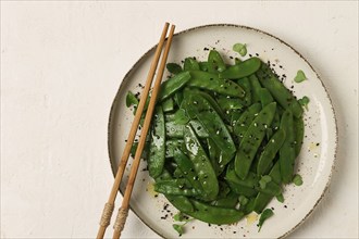 Salad of young peas, in pods, with sesame seeds, asian cuisine, homemade