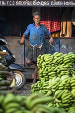 Workers at the banana market, Broadway Market, Ernakulum, Kerala, India, Asia