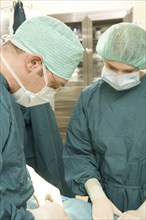 A surgical team in hospital, Leg surgery, Surgery, Federal Republic of Germany