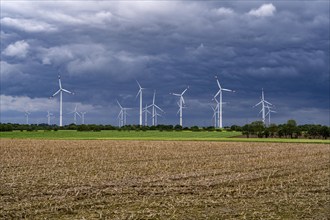 Wind farm east of Geilenkirchen, dark storm clouds, strong wind, North Rhine-Westphalia, Germany,