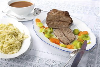 Swabian cuisine, roast beef, roast ox, herb spaetzle, meat dish, gravy, carrot vegetables, leek,