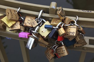 Lover's lock on a railing, love lock is a padlock which, according to custom, is attached to