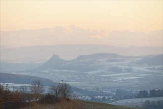 Hegau view in winter with the Alps and the Säntis. Alpenglow at sunset